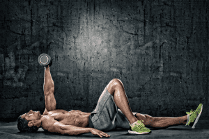Bodybuilder performing dumbbell exercise