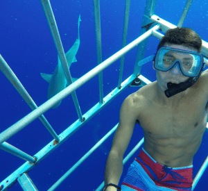 Man in Underwater Cage