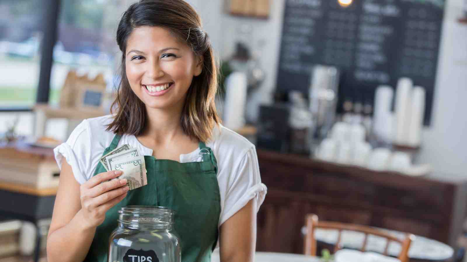 Waitress with tip jar