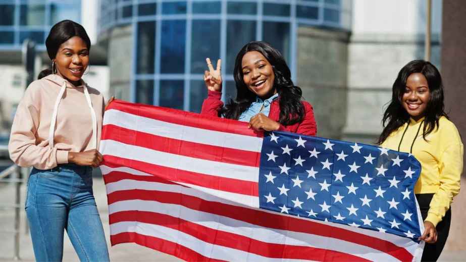 African Immigrants holding american flag