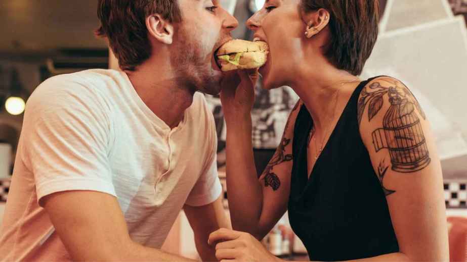 couples sharing a burger
